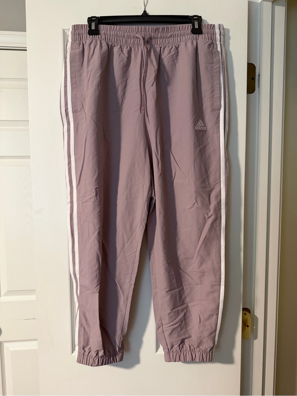 adidas Women’s lavender Joggers with White Side Stripes